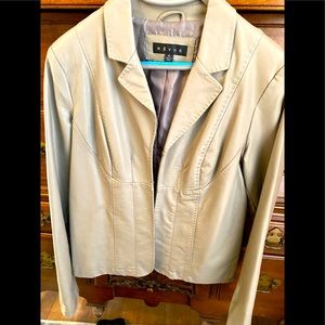 Woman’s jacket. Tan color.  Hook and loop closure